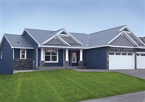 blue house with grey metal roof|gray house with blue roof.